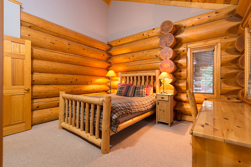 Master log bedroom with king size log bed and ensuite bathroom