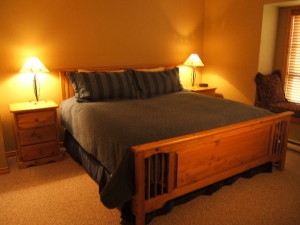 Master bedroom with king bed, mountain views & ensuite bathroom