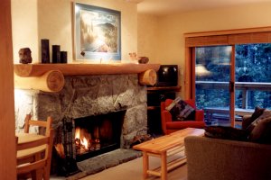 Wood-burning fireplace with log accents for crackling mid-winter fires