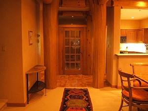 French Doors and Log Accents create warm ambiance