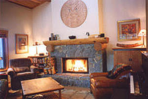 Comfy living room with Native Indian art and wood-burning fireplace for crackling mid-winter fires